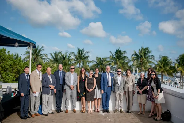 Square Roots with partners on a terrace overlooking a marina